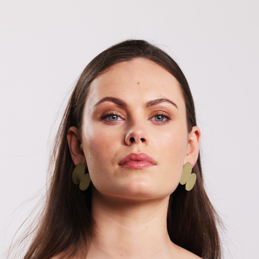 Model wearing the Bold Lines jewellery gold Unity earring