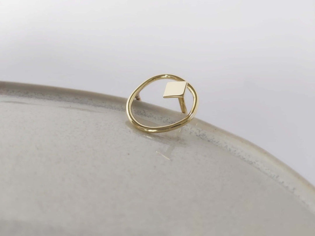 Brass adjustable ring with organic and geometric design.