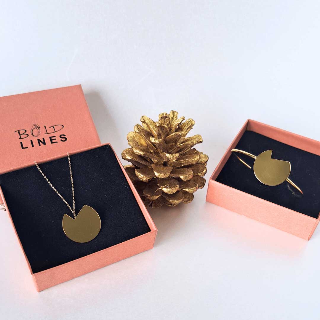 The Balance bold lines jewellery necklace and bracelet shown in their terracotta box