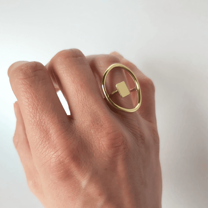 The Imperfection geometric ring by Bold Balance shown on a hand worn at the ring finger.