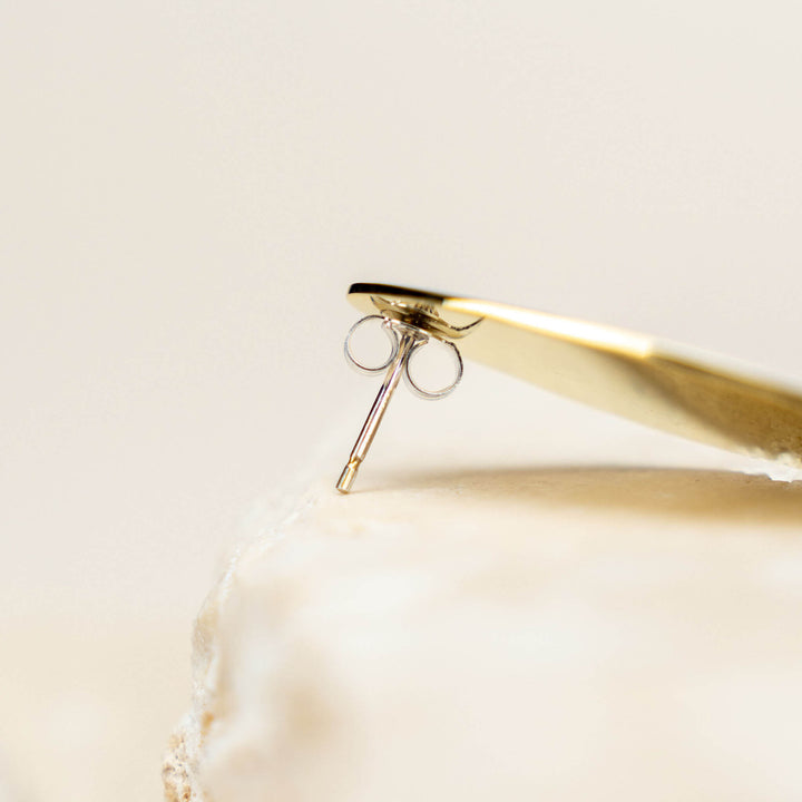 Close up of the sterling silver backs of the gold Connection  I earrings designed by Bold Lines Jewellery 