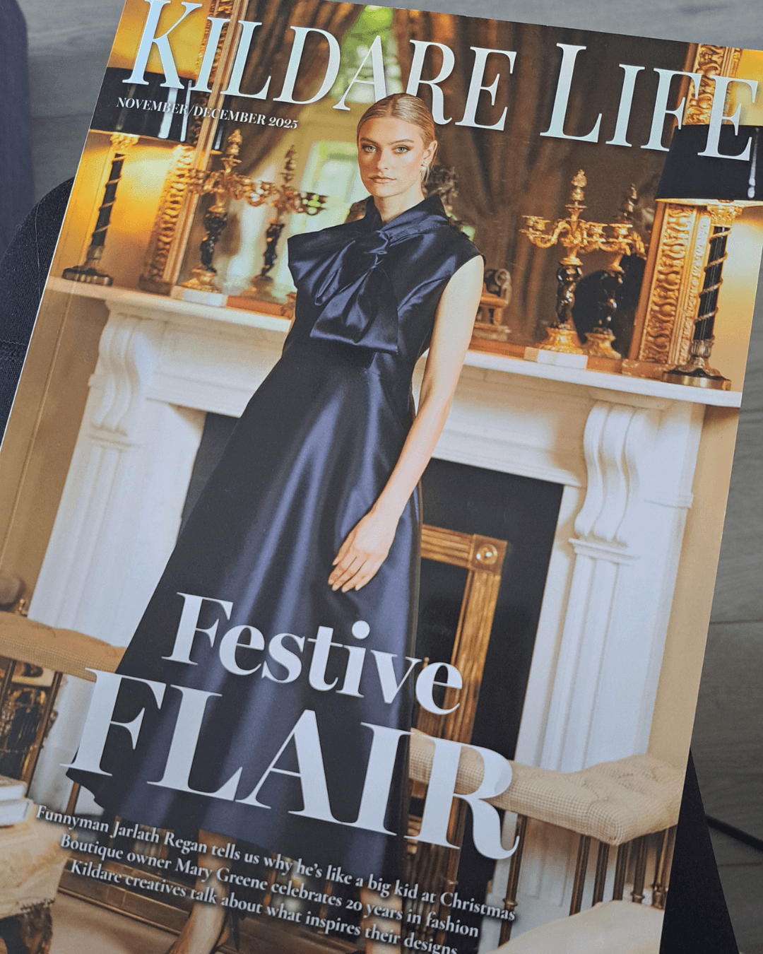 Magazine cover titled 'Kildare Life' featuring a woman in a black dress with festive flair.