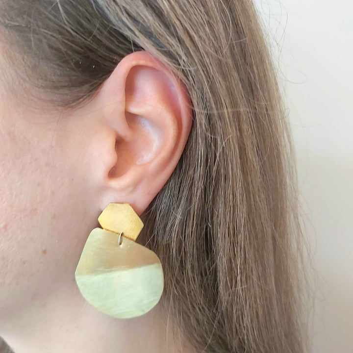 A woman wearing an earring.