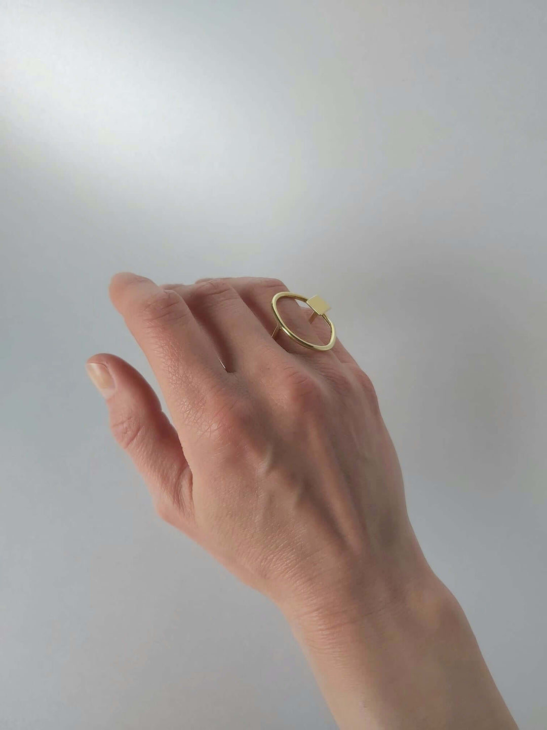 Brass adjustable ring with organic and geometric design.