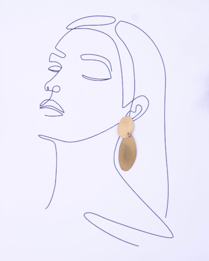 An illustration of a women wearing an earring.