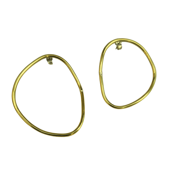 Imperfection organic hoops earrings with sterling silver backs designed by Bold lines jewellery shown on a white background