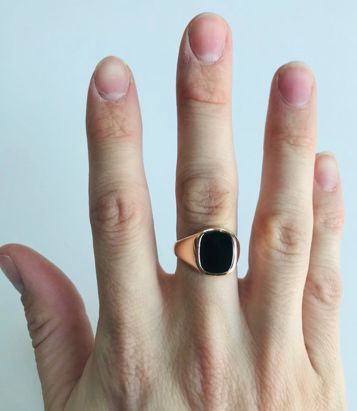 Laura's rose gold and onyx ring worn on a woman's hand designed by Bold Lines jewellery in Ireland