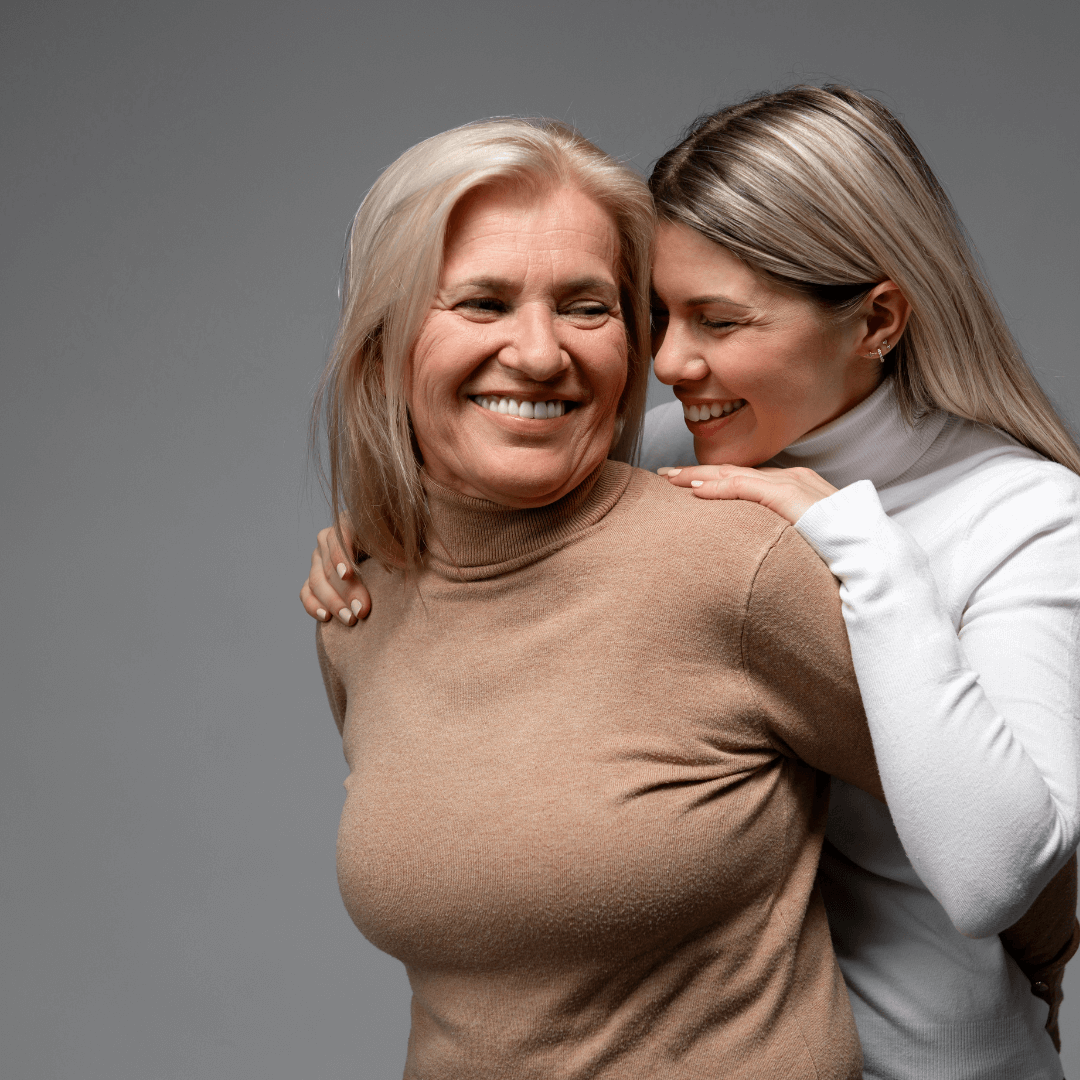 Photo of a mom and daughter smiling at each other