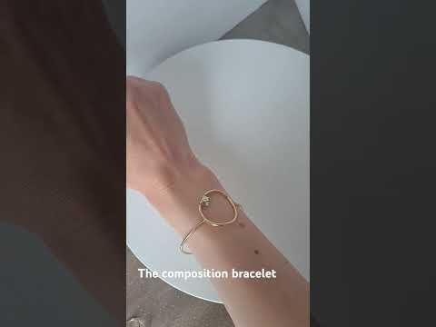 video of the Composition bracelet by Bold lines Jewellery worn on a woman's wrist in front of a  white backdrop.